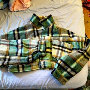 selling a brown, black and green flannel.